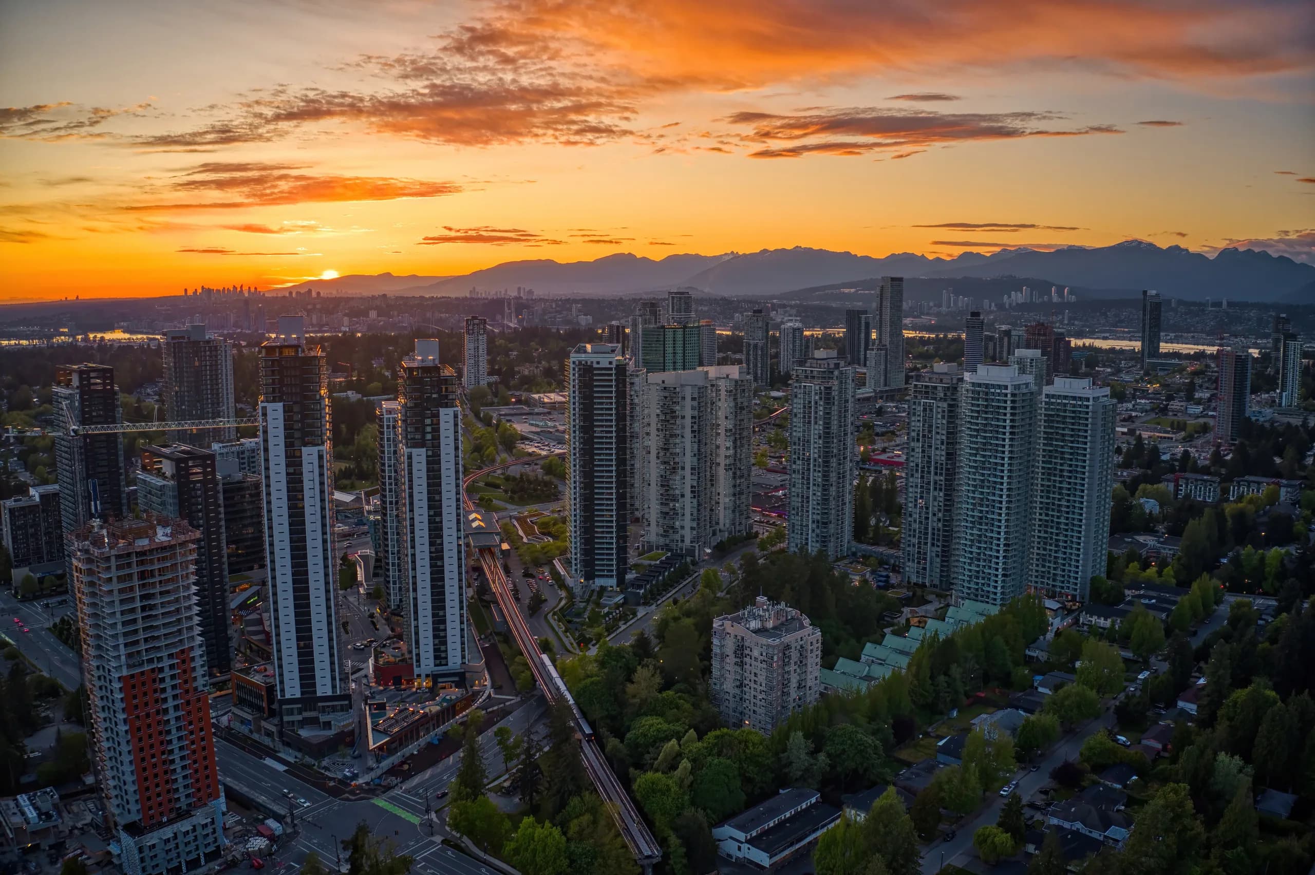 Aerial view of the Surrey and Lower Mainland skyline at sunset